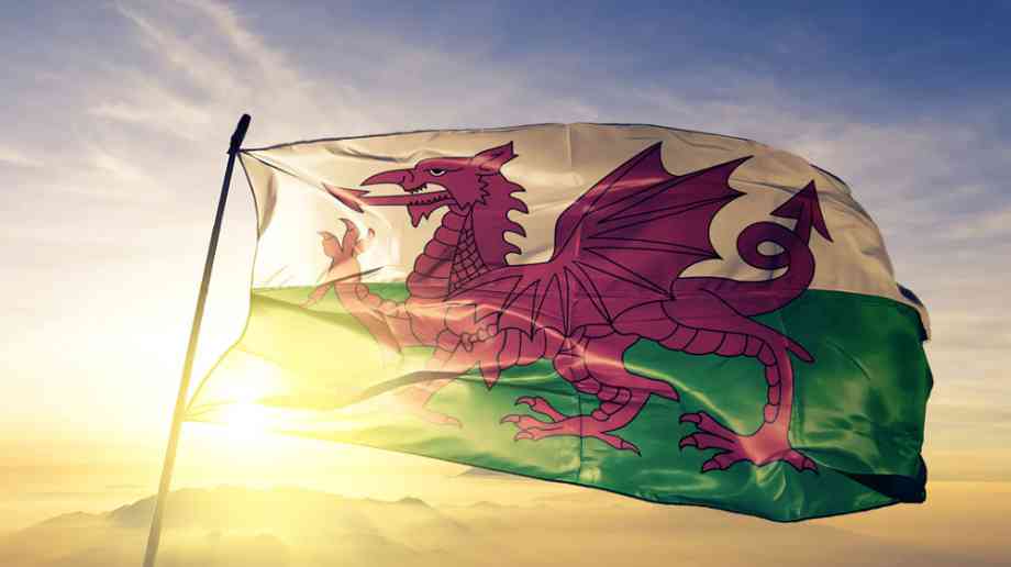 Welsh flag in front of sun.