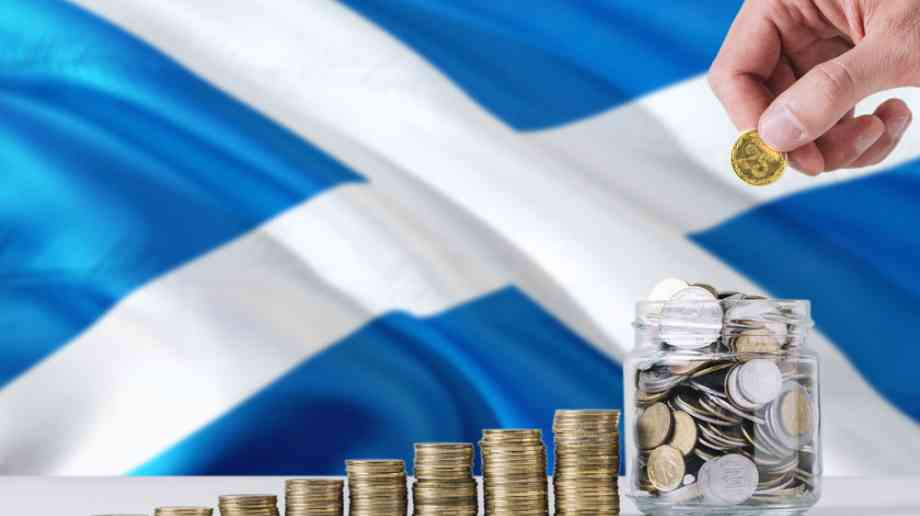 Scottish flag behind money