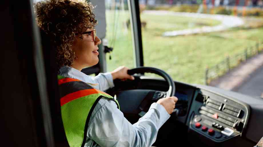 Woman taking bus driving test