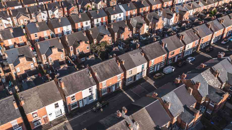 Aerial view of terraced housing estate.