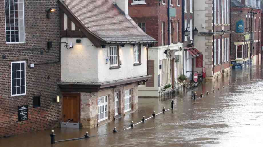 A flooded town high street. A flooded town high street.
